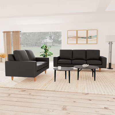 Skyline sofasæt fra Hjort Knudsen i mørkebrunt soleda læder og ben i naturolieret eg. 