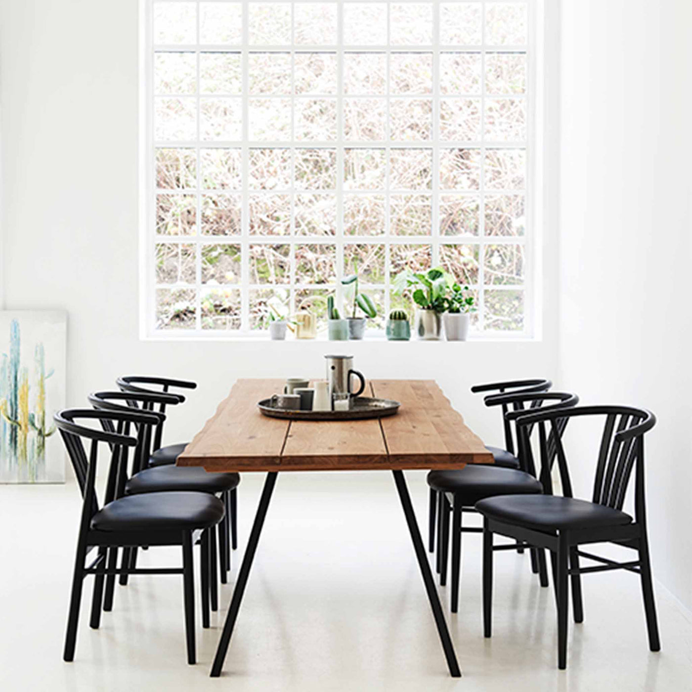 Svane Design Salon spisebordsstol i sortbejdset bøg med sort sæde i tekstillæder.